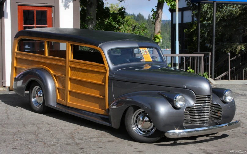 an old fashioned woodie is parked on the street