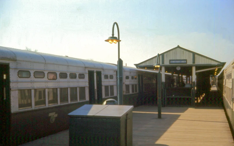 several trains are parked in a train depot