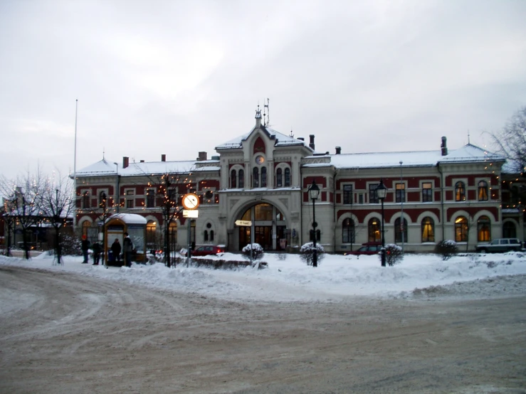 a building with lights on it in the snow