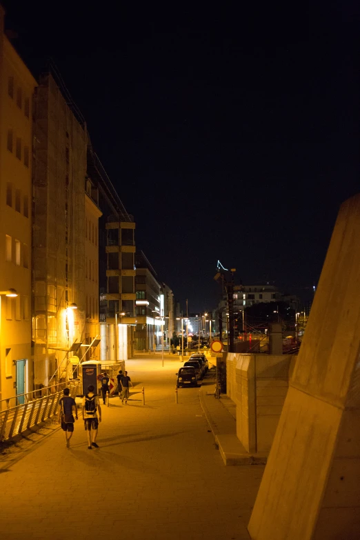 the night time view of a street that is very quiet