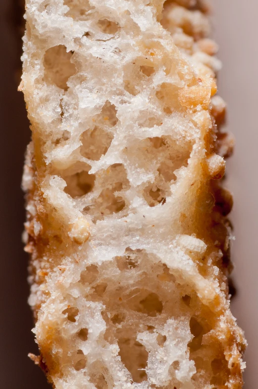 a half eaten pastry is shown on a brown surface