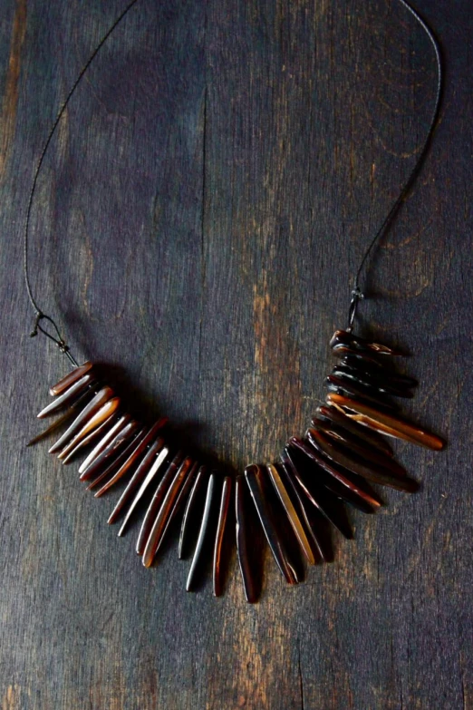 the necklace has many small brown beads