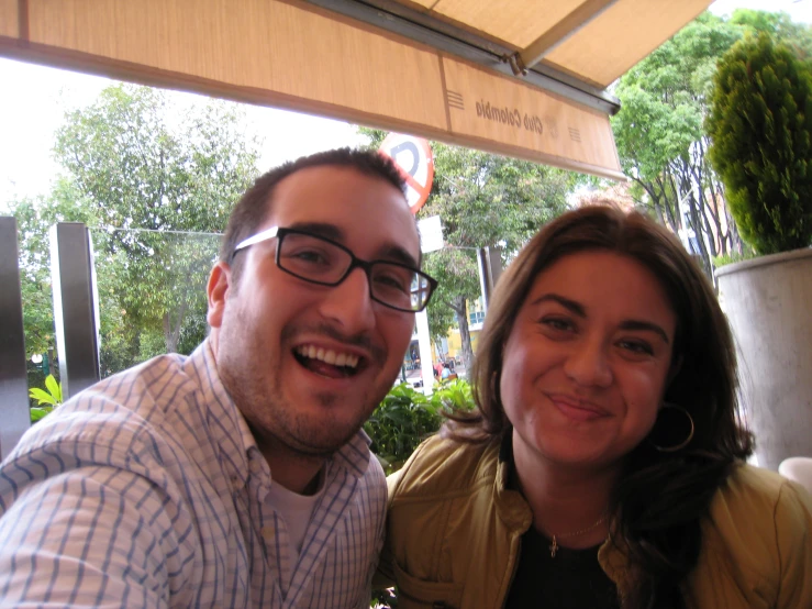 man and woman enjoying themselves at a restaurant