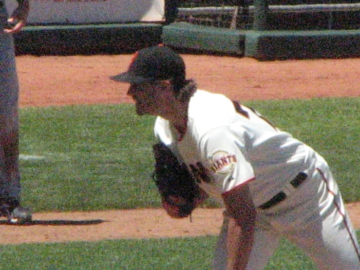a baseball pitcher on the mound in action