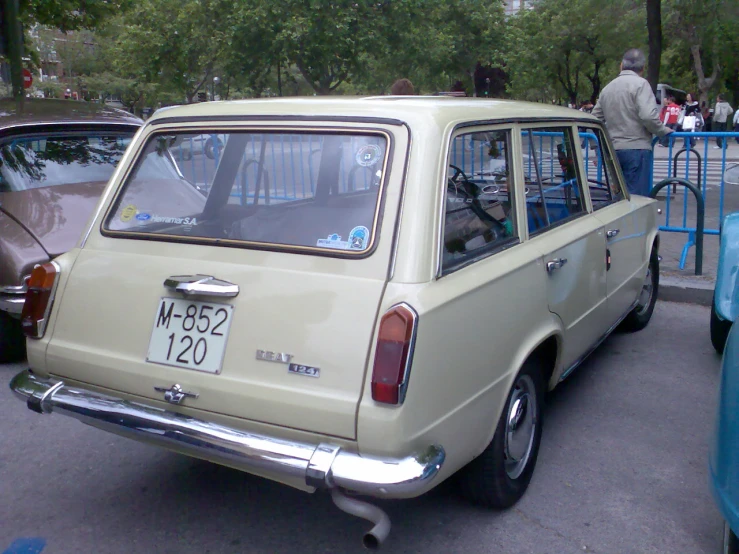 the back of a beige station wagon car