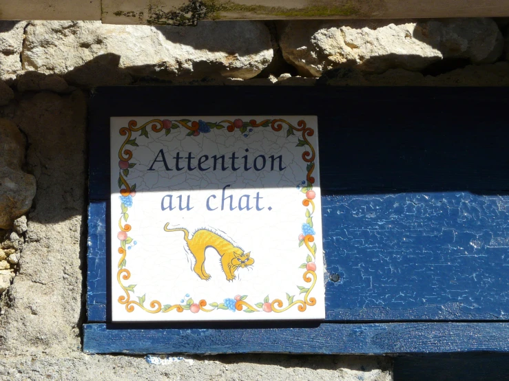 a close up of a sign on a bench