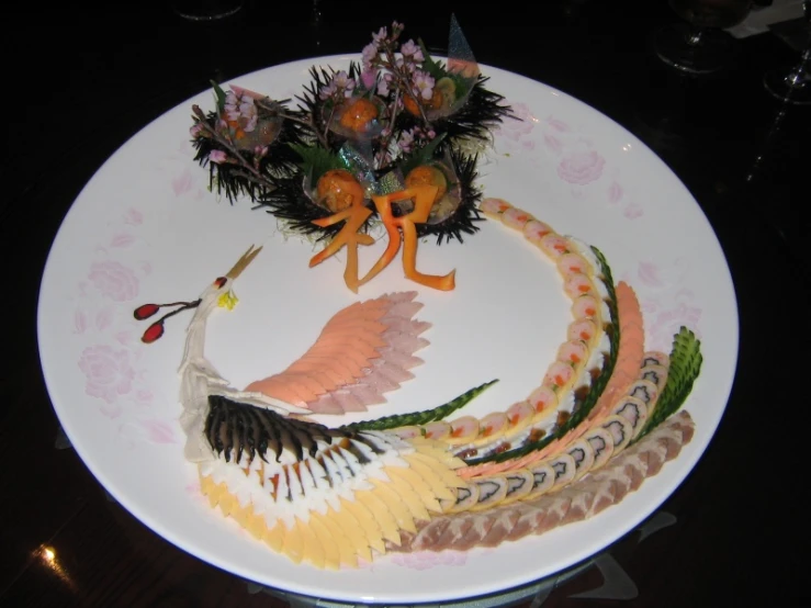 decorative flowers are on top of an elaborate plate