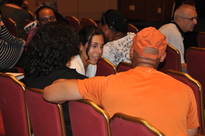 several people seated together in an auditorium