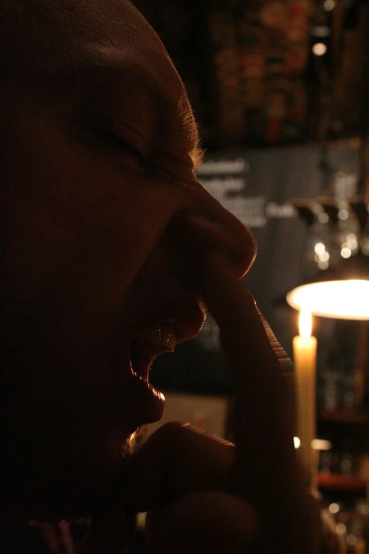 a man that is eating soing near a table