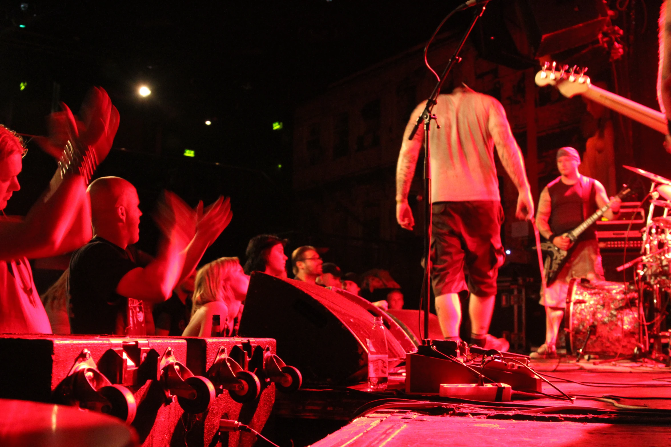 people playing on a stage in the dark