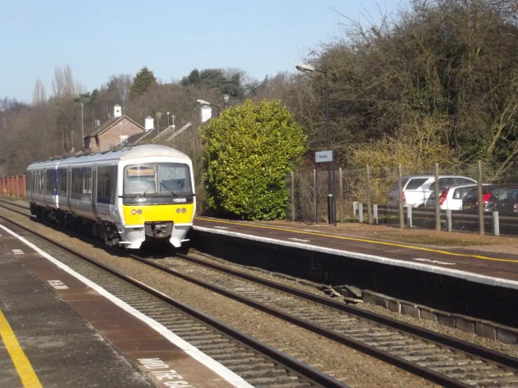 a train is traveling on the railroad tracks