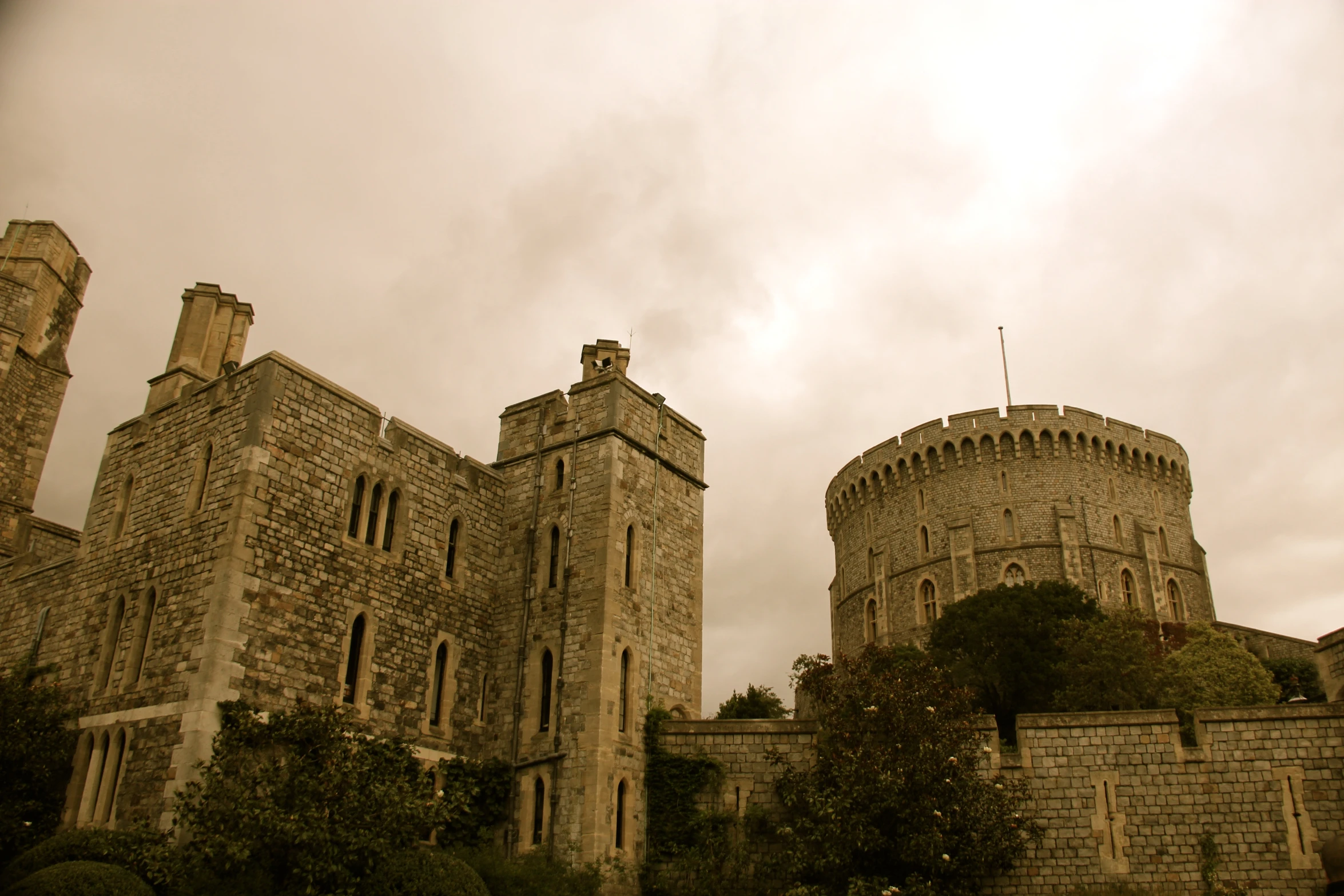 a castle is in the middle of the day with the sun peeking out