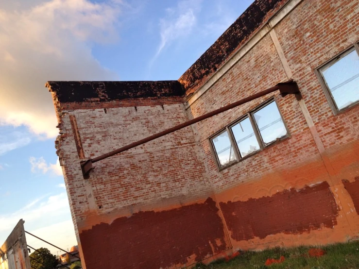 a brick building that is up against the sky