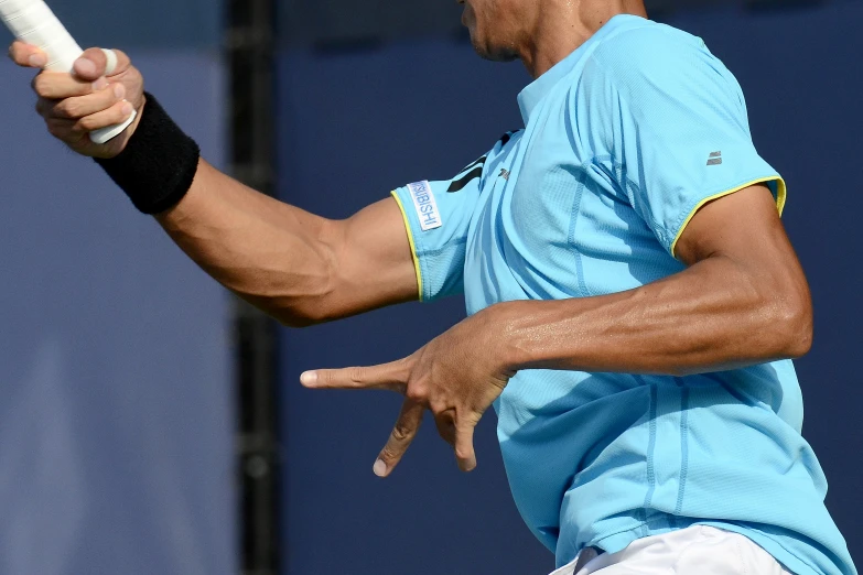 a man swinging a tennis racquet at a ball