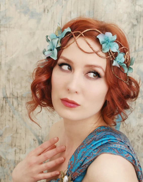 woman with hair in flower crown wearing necklace