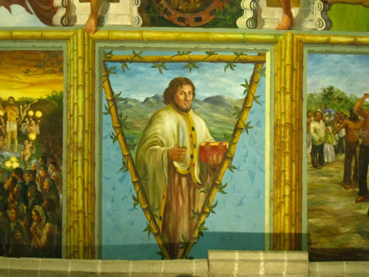 an ornate wall with paintings depicting the life of jesus