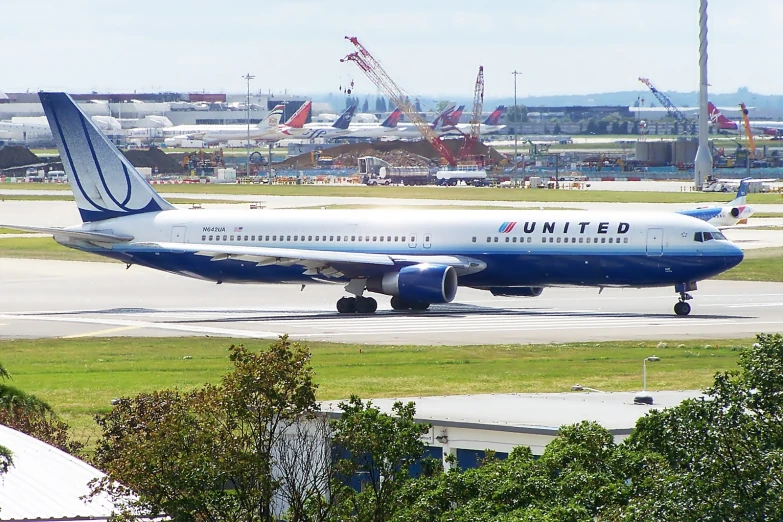 a passenger plane on the runway at an airport