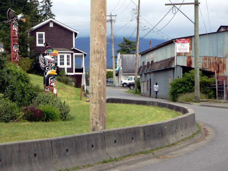 a neighborhood on the edge of a curvy road