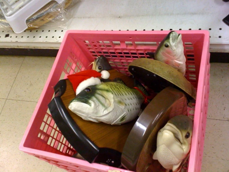 this is a small shopping cart with a variety of stuffed animals