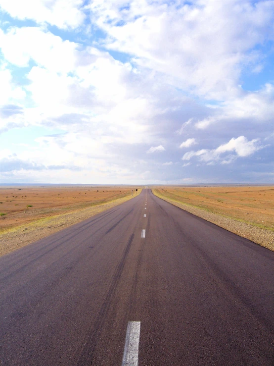 a long empty road with no people on the side