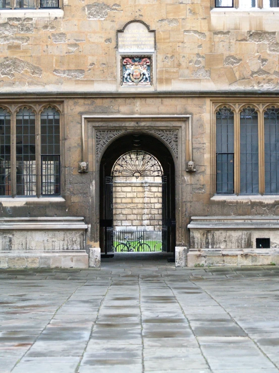 an open doorway with a stone wall behind it