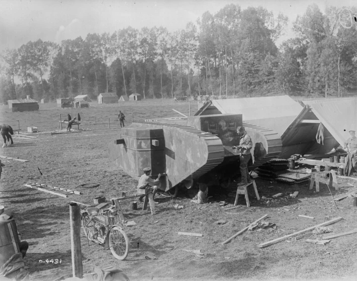 a group of people working on a large object