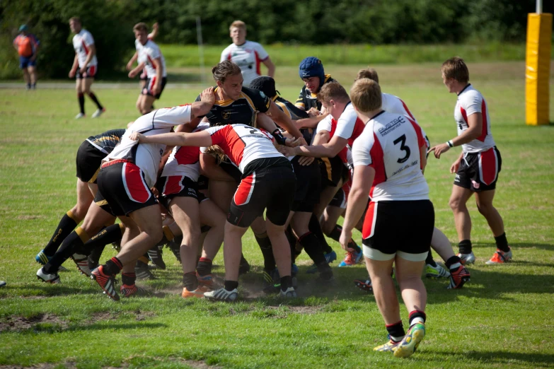 a group of girls playing a game of rugby