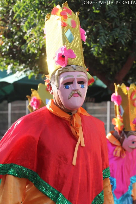 some very cute masked people dressed in costumes