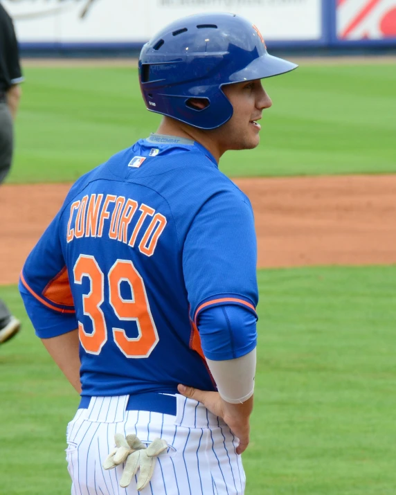 a baseball player standing at the home plate