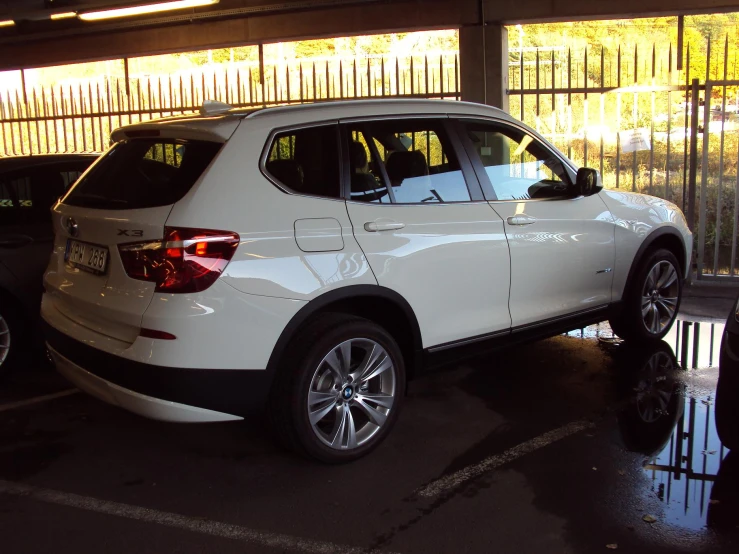 bmw is parked in a parking garage