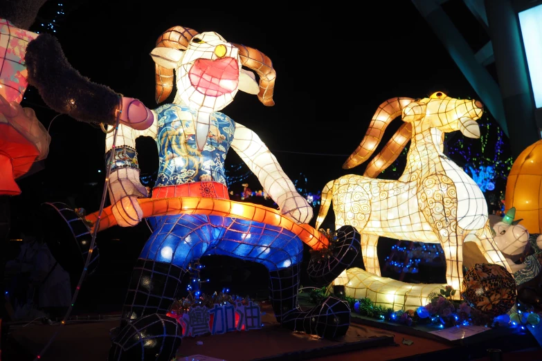 a lighted display of two decorative animal figures