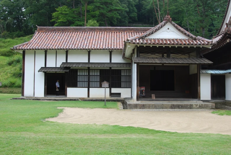 an old building that has some people in it