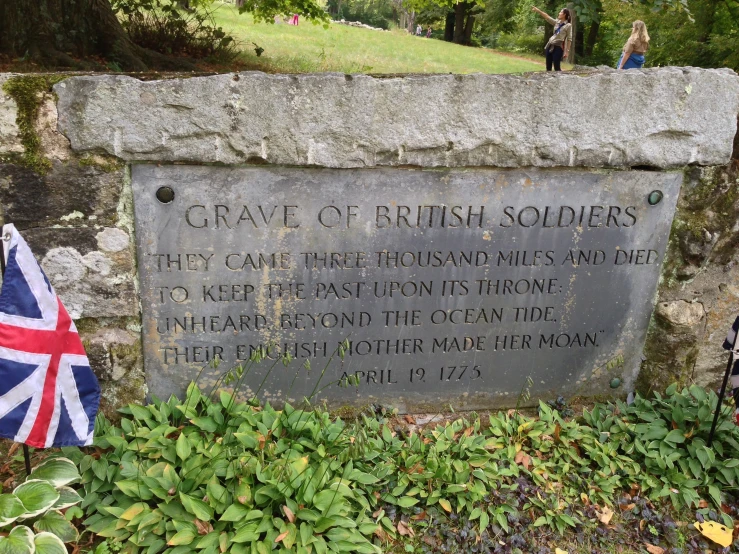 a monument has a flag placed next to it