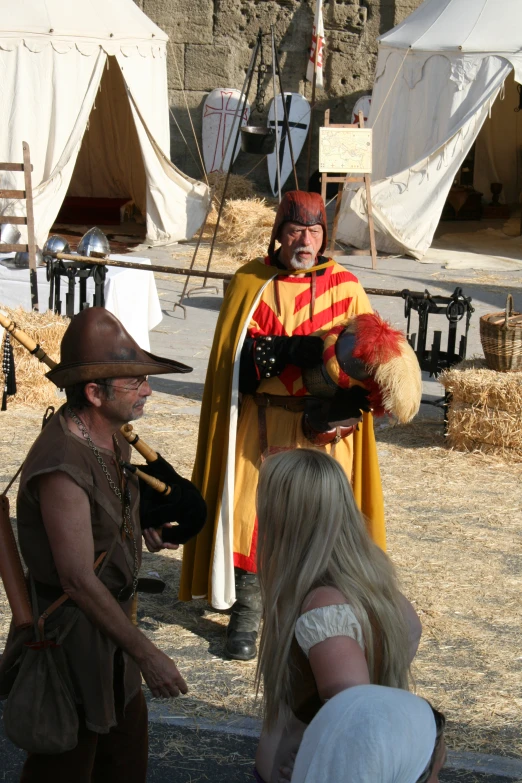 a man dressed up as a knight being filmed by people