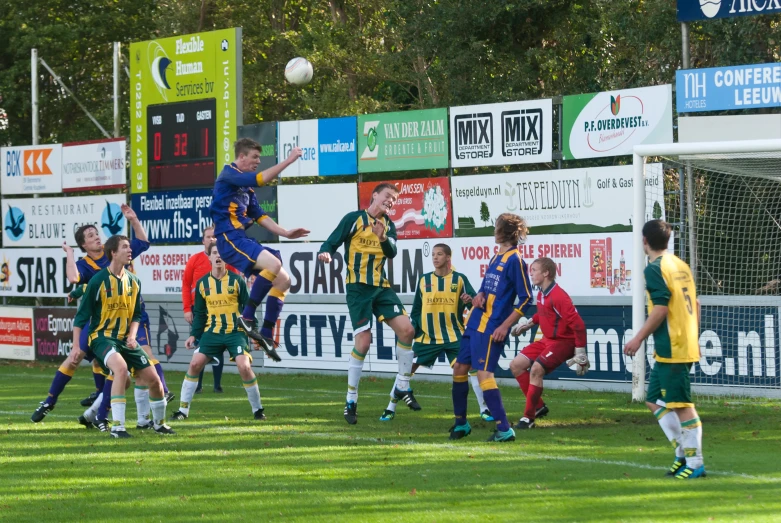 a group of young men playing a game of soccer