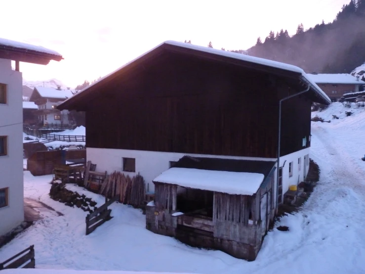 a snow covered village surrounded by mountains