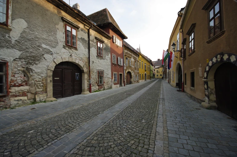 a cobblestone street that looks like an old medieval village