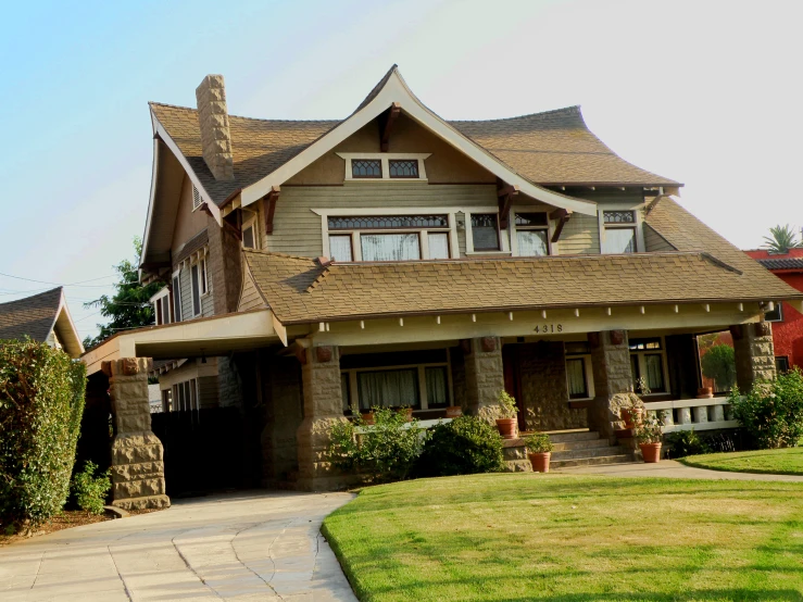 the house has two large windows on the front