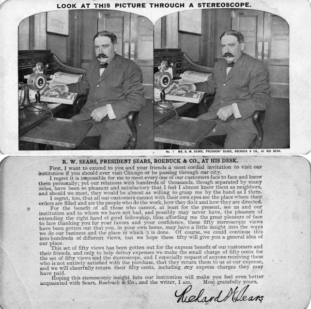 a poster with two men seated at a desk