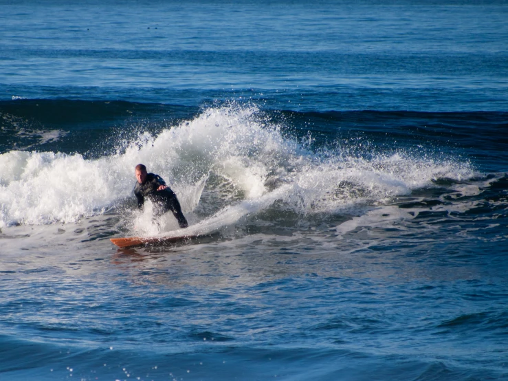 a person riding a surfboard in the ocean