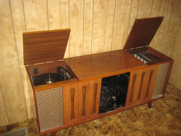 a vintage radio with matching cabinet and wall