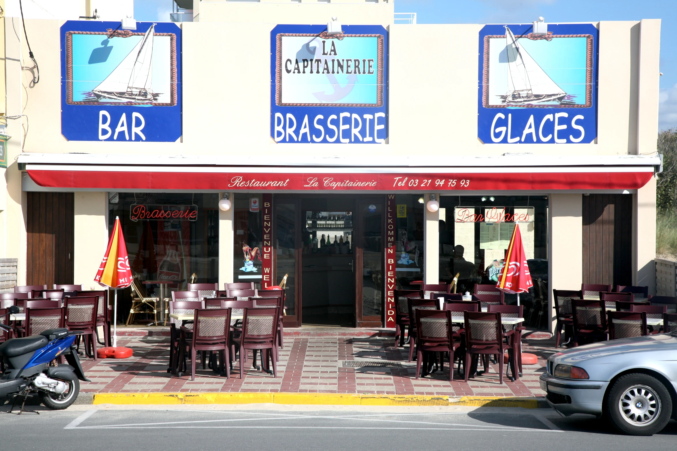 a building that has a table and chairs outside of it