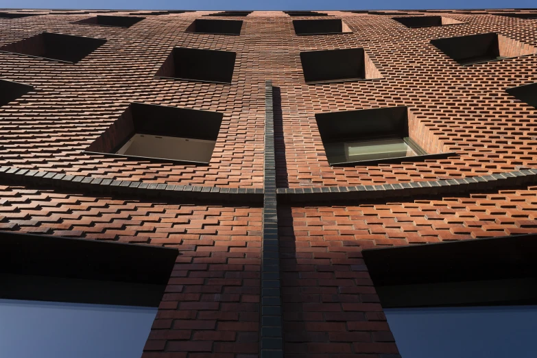 a tall red brick building with several windows