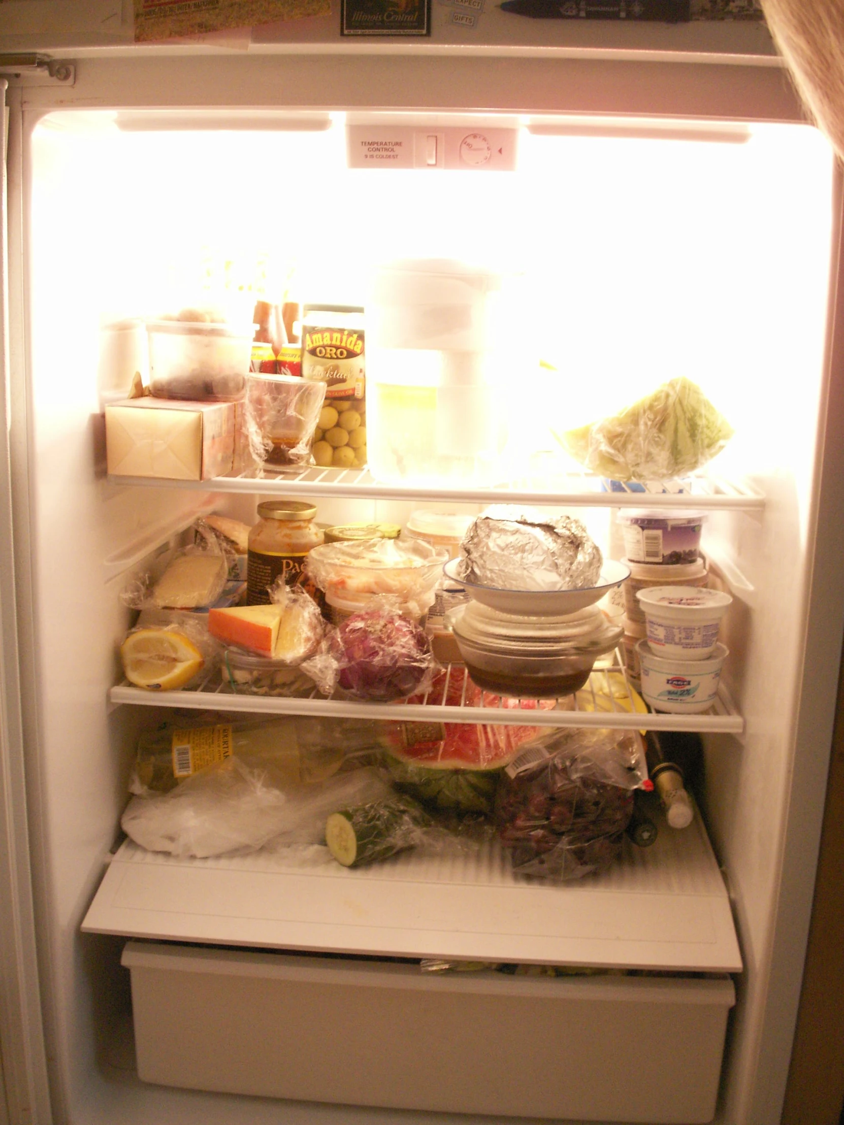 a white refrigerator filled with food and drinks
