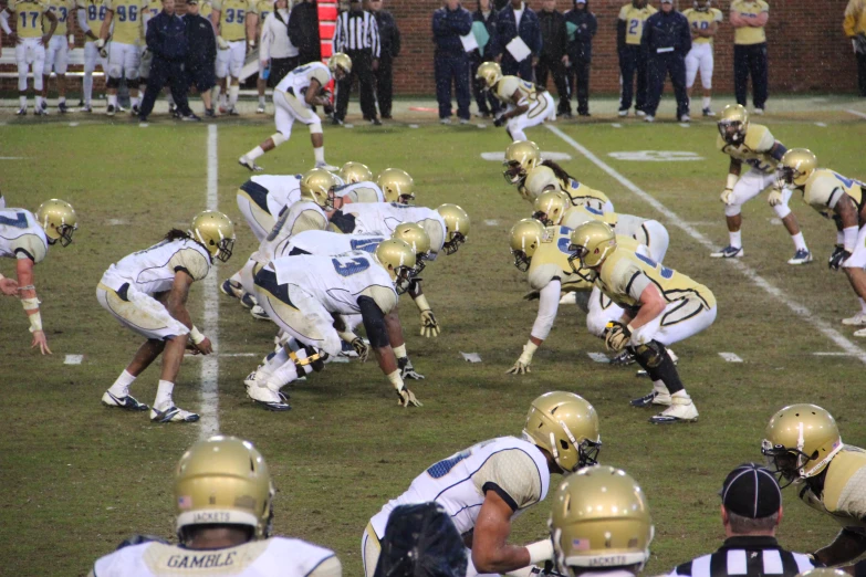 football players running and playing on the field