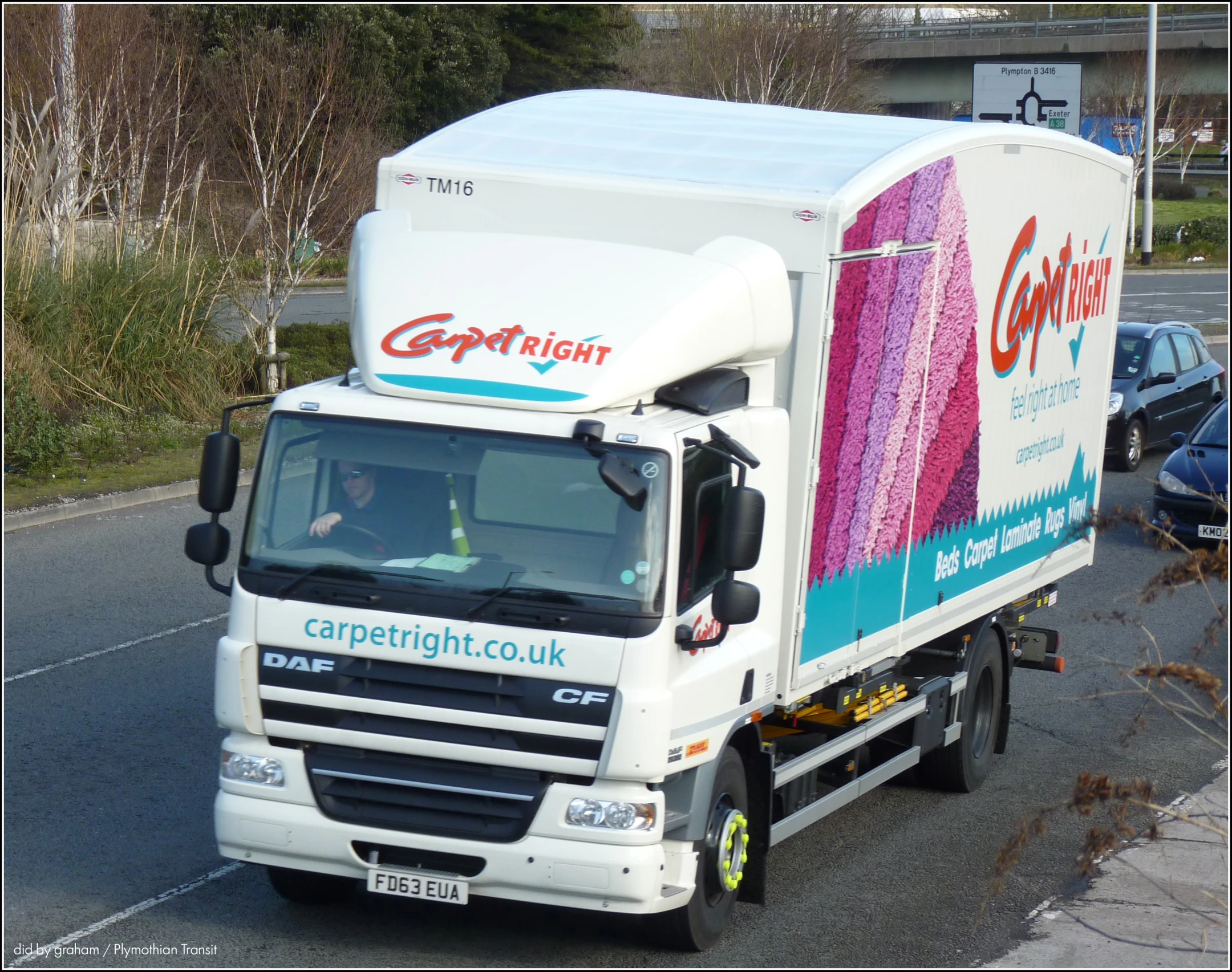 a big semi truck with a canopy advertising for cannisteigh court