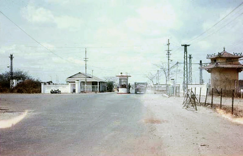 a street with old shacks on the other side