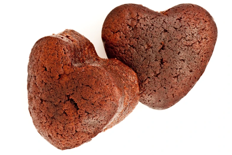 two heart shaped cookies with white background