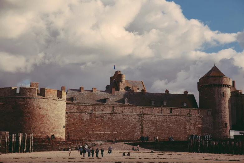 an old castle with three walls and two towers