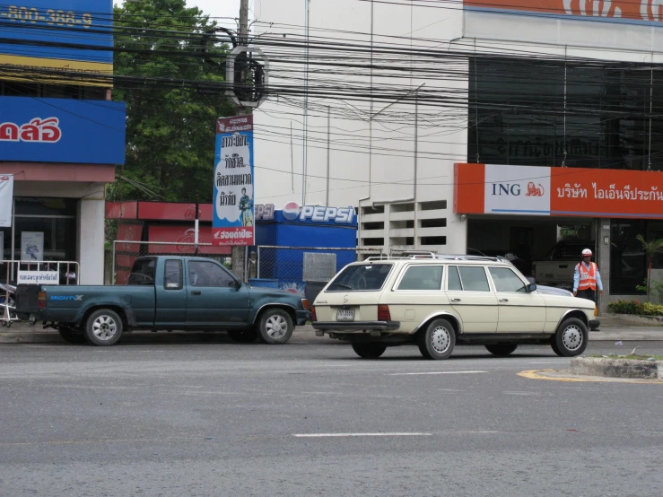 a couple of cars are traveling down the road